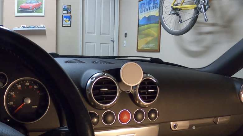 The Apple Magsafe charger mounted to a RoundMount vent mount made specifically for a first-generaiton Audi TT.