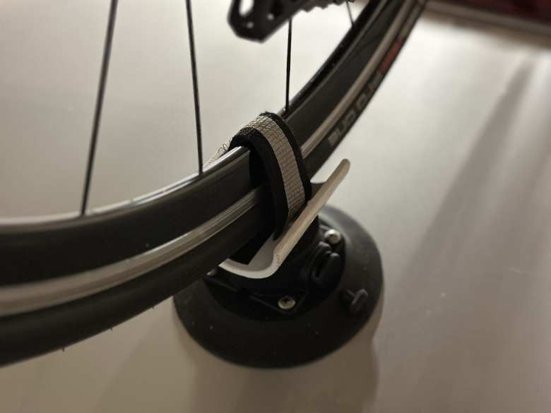 Close-up of the rear wheel mount with the rear wheel strapped in.