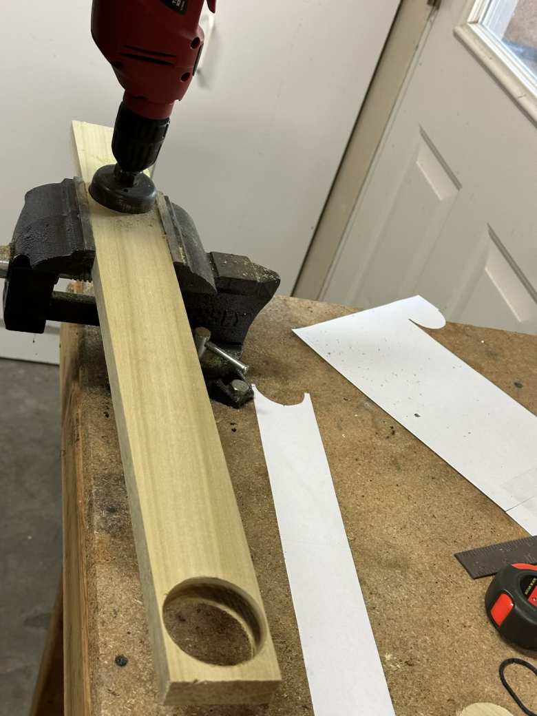 Then I proceeded to manufacturer the wood base for my bicycle fork mount. Here I am drilling holes of approximately 1-7/8 inches spaced apart per the paper template.
