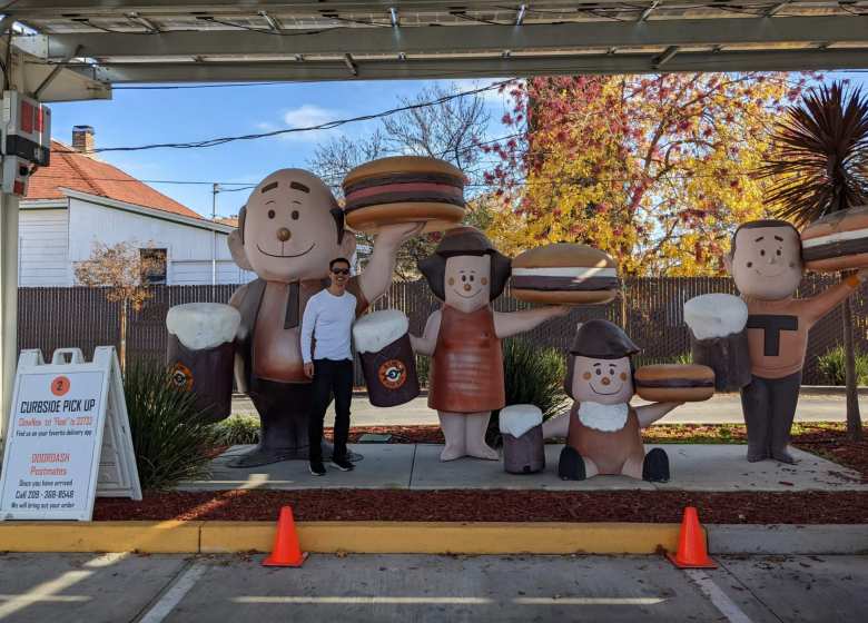 Felix Wong in front of an A&W Restaurant drive-in display in Lodi, California.