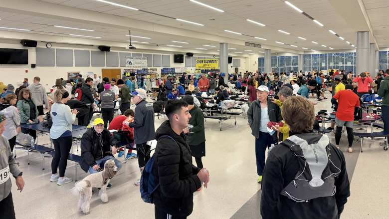 There were hundreds of runners (and a dog) inside the lunchroom at Severna Park High School before the start of the marathon and half marathon.
