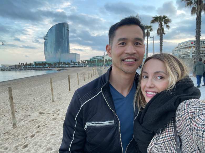 Felix and Andrea in front of the beach and the W Barcelona.