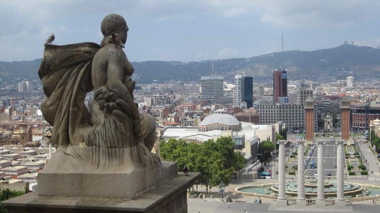 Statue overlooking the Magic fountain of Montju
