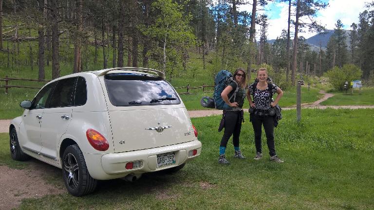 vanilla 2005 Chrysler PT Cruiser GT, ladies wearing backpacks, Willow Creek trailhead, Black Hills, South Dakota