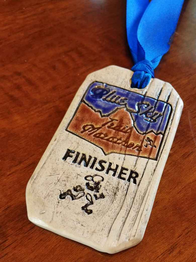 The 2018 Blue Sky Trail Marathon finisher medal. The 2018 Blue Sky Trail Marathon finisher medal.