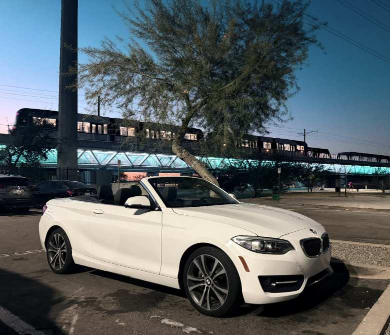 The Alpine White 2016 BMW 228i Convertible I rented through Turo.