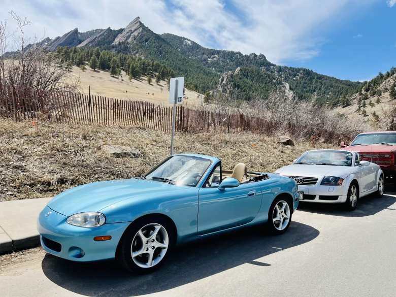 Manuel's crystal blue metallic Mazda Miata and my silver Audi TT Roadster Quattro in front of the flatirons of Boulder Mountain Park.