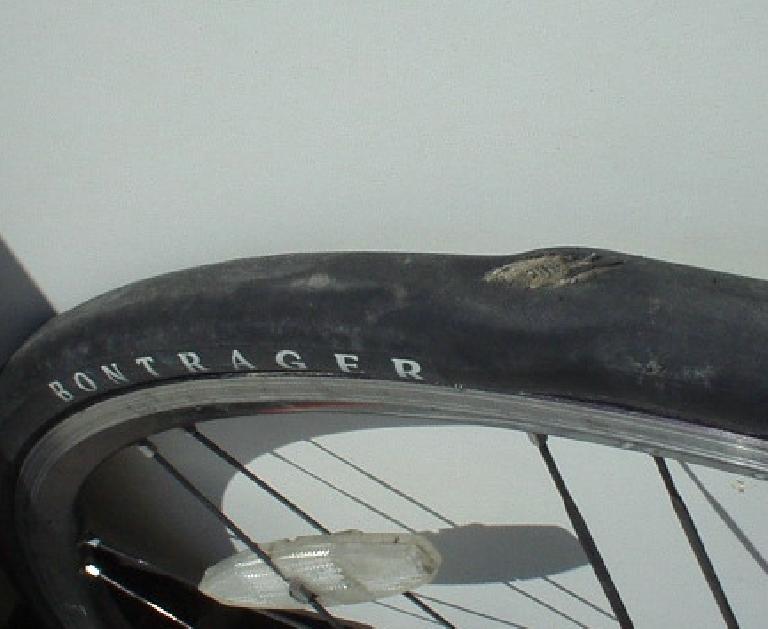 At Mile 0.5 of an 82-mile ride, Sandi's rear tire went thump-thump.  Upon further inspection we discovered this.  To think she raced a half-Ironman triathlon on this tire!