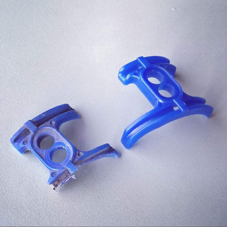 broken blue bottom bracket cable guide with replacement