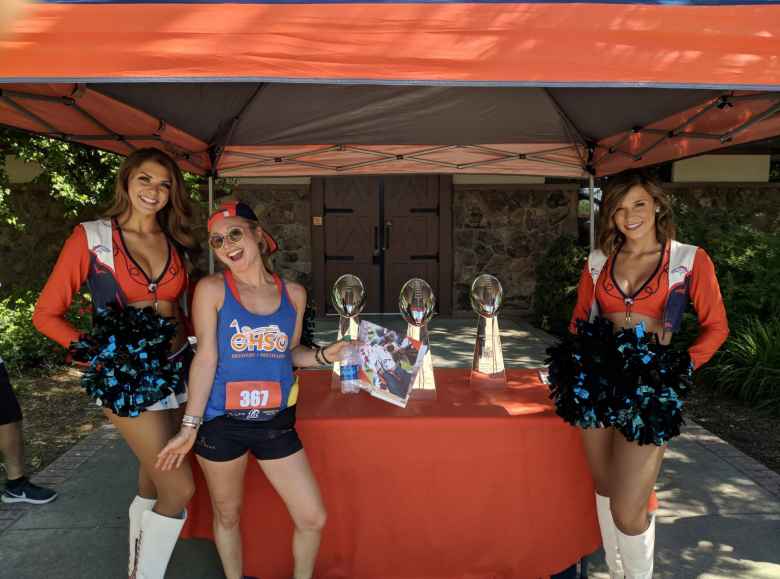 Emily with two Broncos cheerleaders.