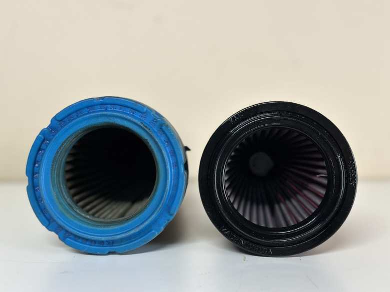 The open end of the stock (OEM) air filter for a Buell Blast and the K&N BU-5000 drop-in replacement.