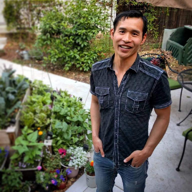 Felix Wong in front of the garden at Stan's casita in Sacramento.