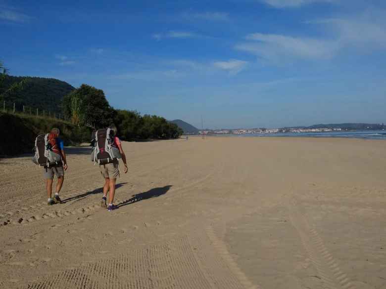 John and Karen from the UK along the beach near Argoños, Spain. They had crewed for the Race Across America (RAAM) last year.