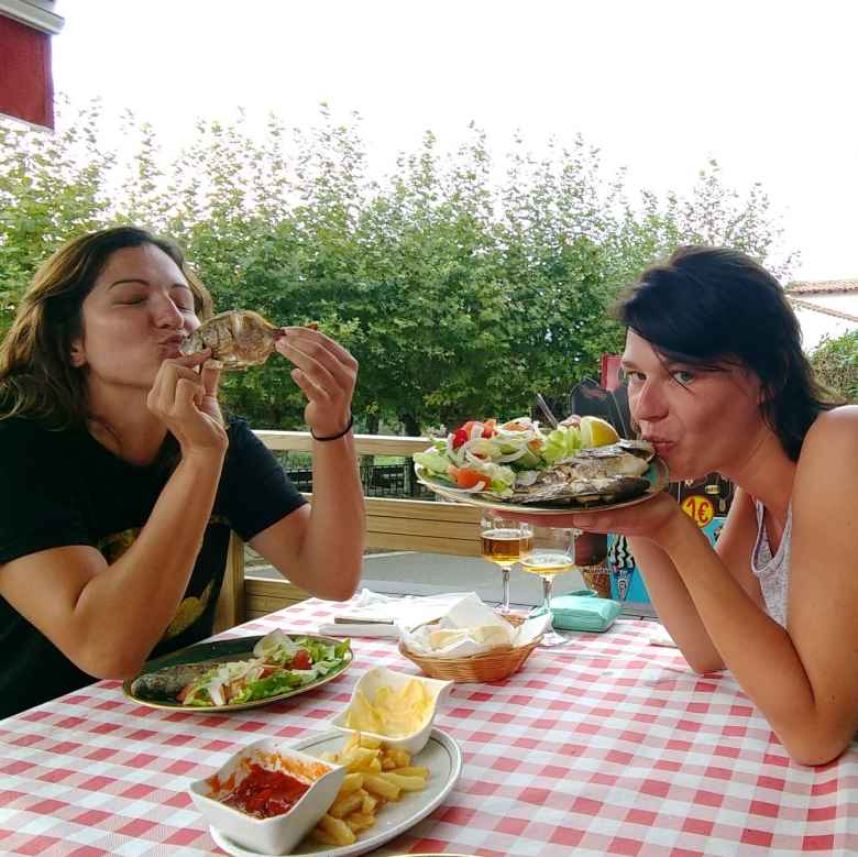 Jenny of Toronto and Teresa from Berlin eating fish at Bar CaÃ±ado in CÃ²breces, Spain. I met them across the street in Albergue Viejo Lucas. 