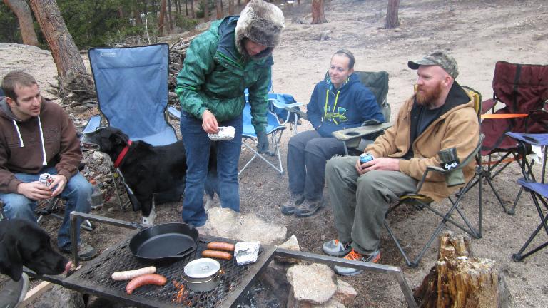 Cooking dinner on the campfire.