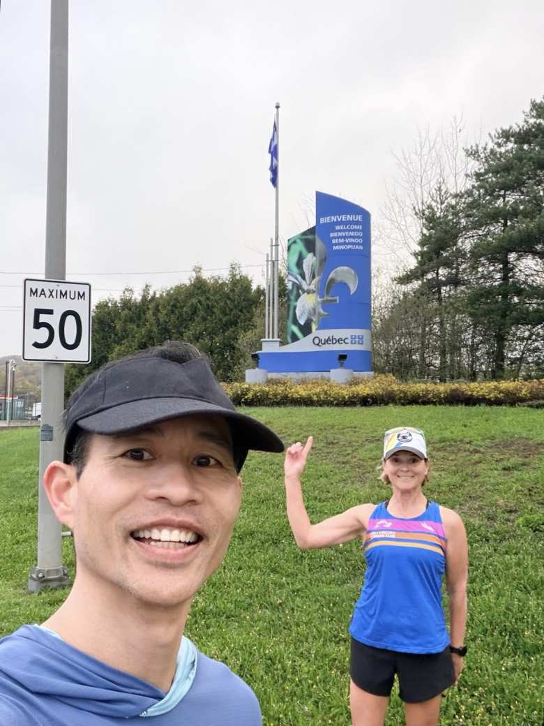 Felix and Mel by another welcome sign in Temiscaming, Quebec.