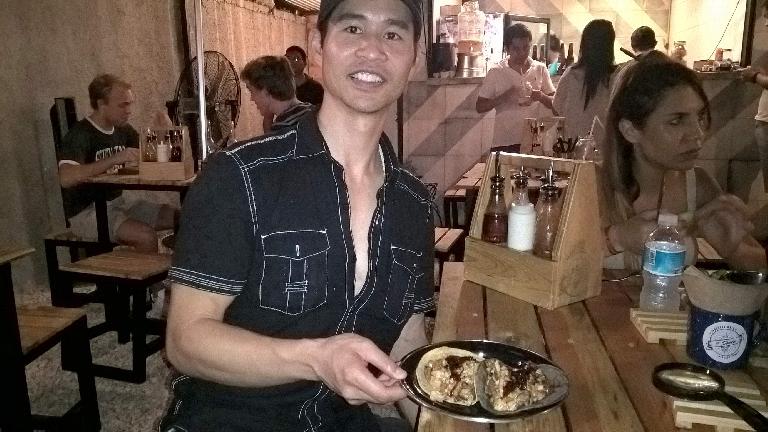 Felix Wong, black shirt, two tacos, Carla