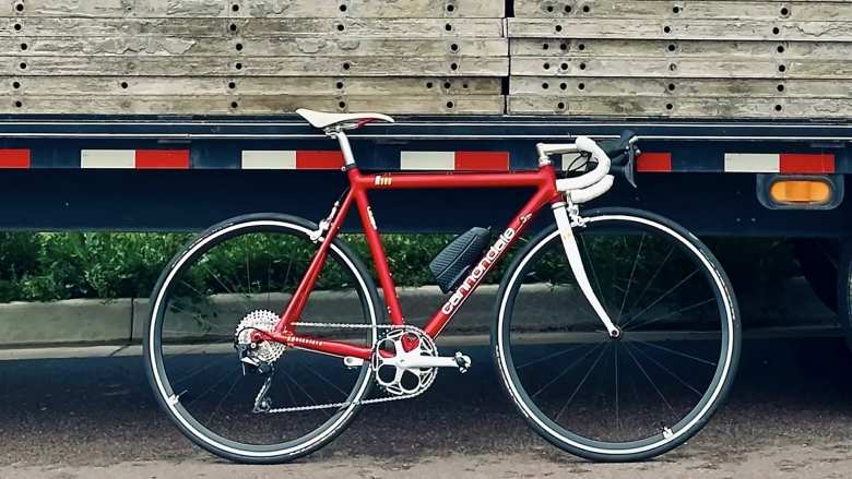 Canny in front of a truck.