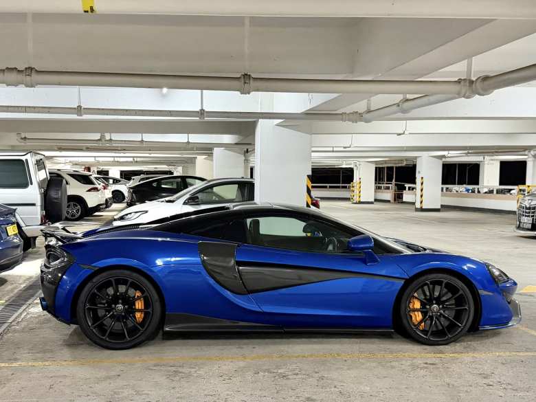 A blue McLaren 600LT Spider (2012-2014).