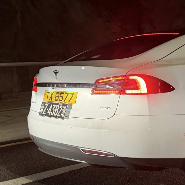A Tesla with both Hong Kong and Macau license plates.