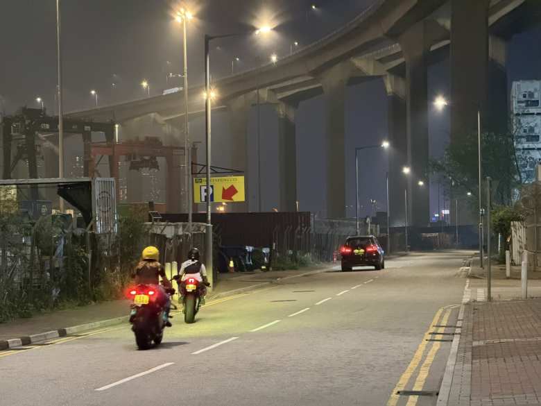 A couple of sportbike riders leaving their gathering at Stonecutters Island.