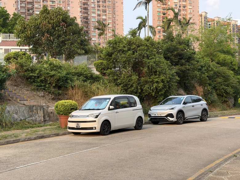 The car in front is a Toyota Spade 