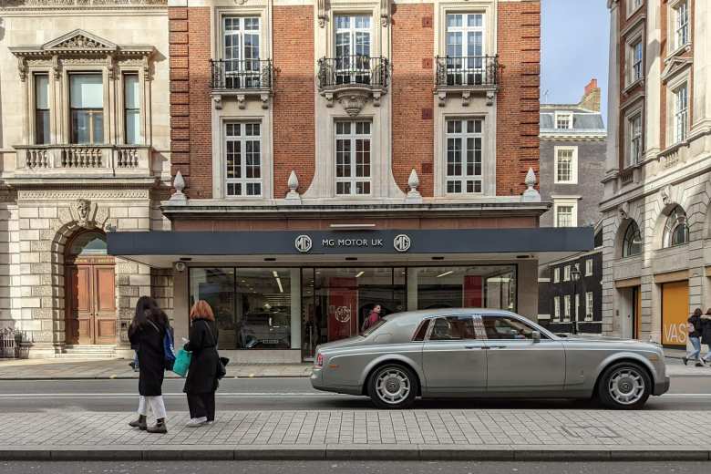 A silver Rolls Royce in front of MG Motor UK near Piccadilly Circus in London.