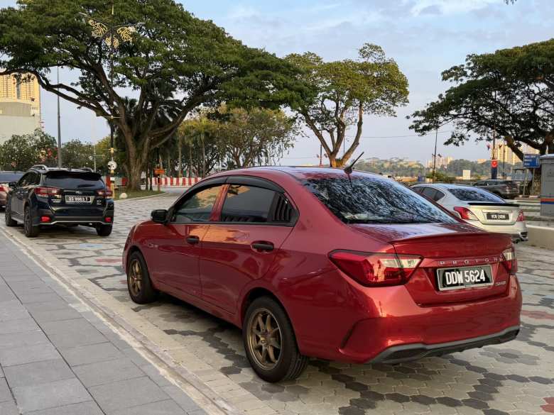 A red Proton Saga.