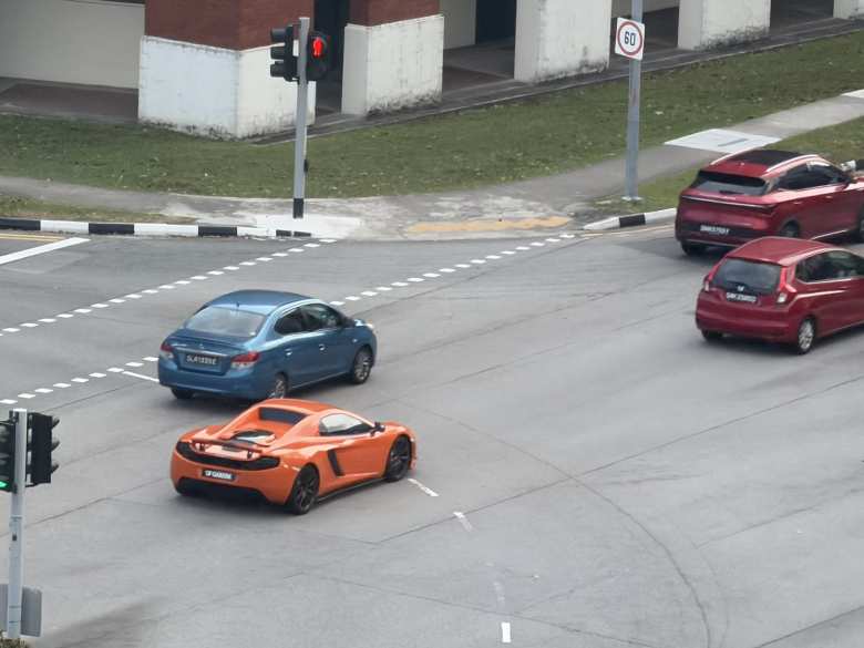 An orange McLaren MP4-12C.