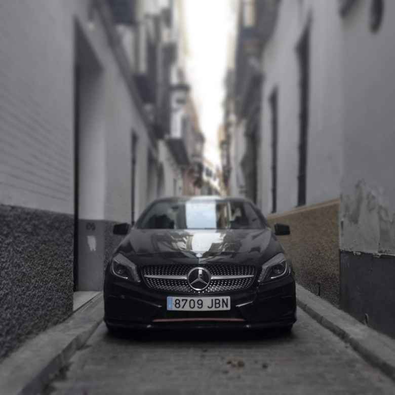 A black Mercedes sedan in the streets of 