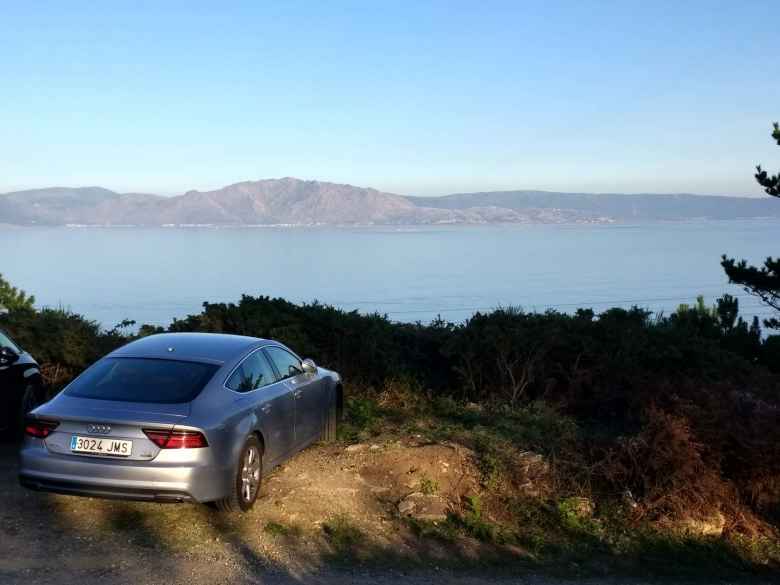 A silver Audi A7 along the eastern shore of Fisterra, Spain.