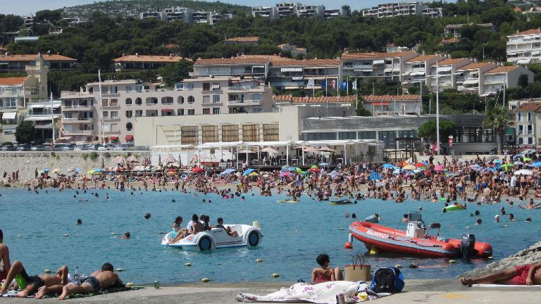 Water vessels in the water at the beach of Cassis.