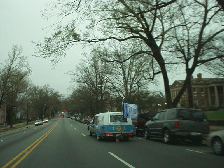 I happened to be downtown when UNC just beat Michigan State to make it into the Final Four in the NCAA mens basketball tournament, and hence this hearse in the UNC colors was cruising through.  UNC would later win the championship.