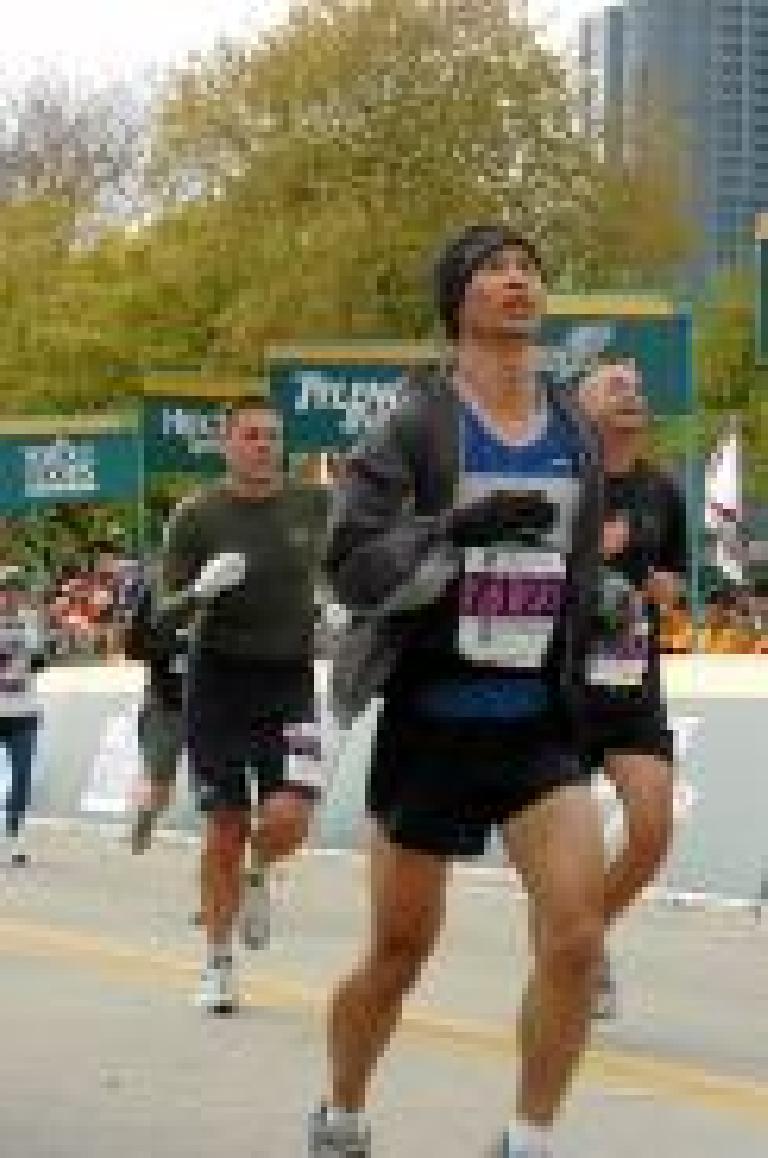 Fighting off a left calf leg cramp for the last 4 miles, I managed to run into the finish. Photo: marathonfoto.com. Fighting off a left calf leg cramp for the last 4 miles, I managed to run into the finish. Photo: marathonfoto.com.