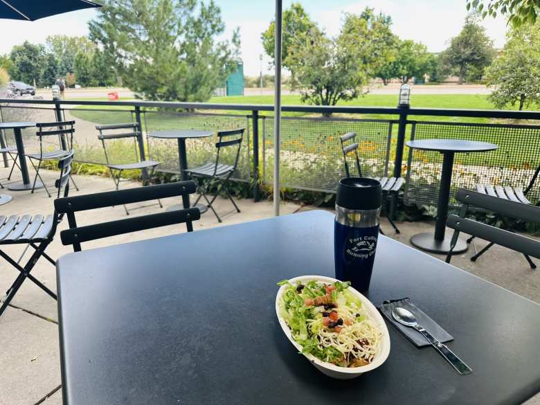 Enjoying a burrito bowl on the patio of Chipotle in south Fort Collins.