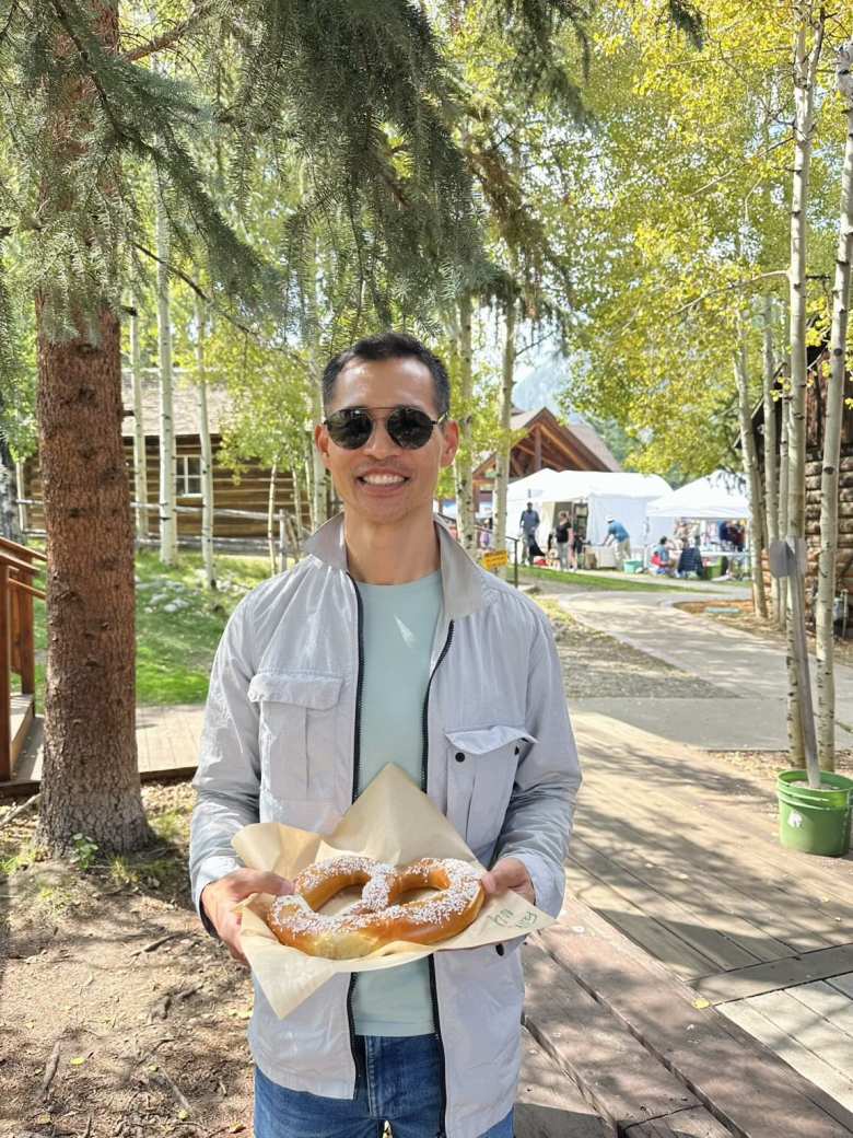 Felix with a humungous pretzel from the Frisco Fall Fest.