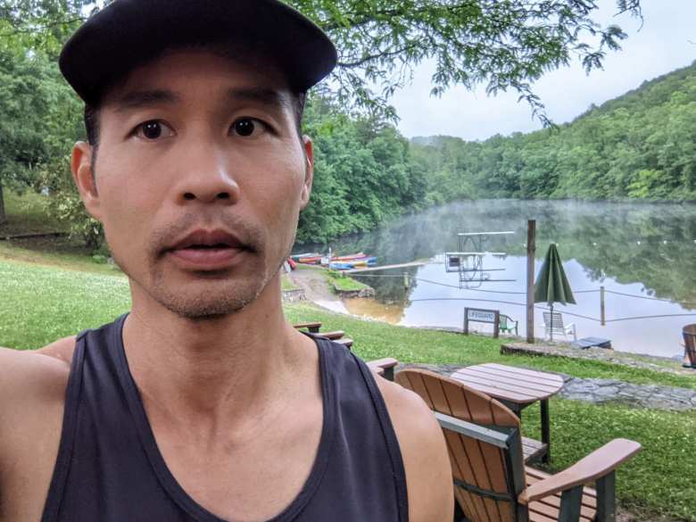 Felix Wong in front of Loch Haven Lake before the Conquer the Cove Trail Marathon.