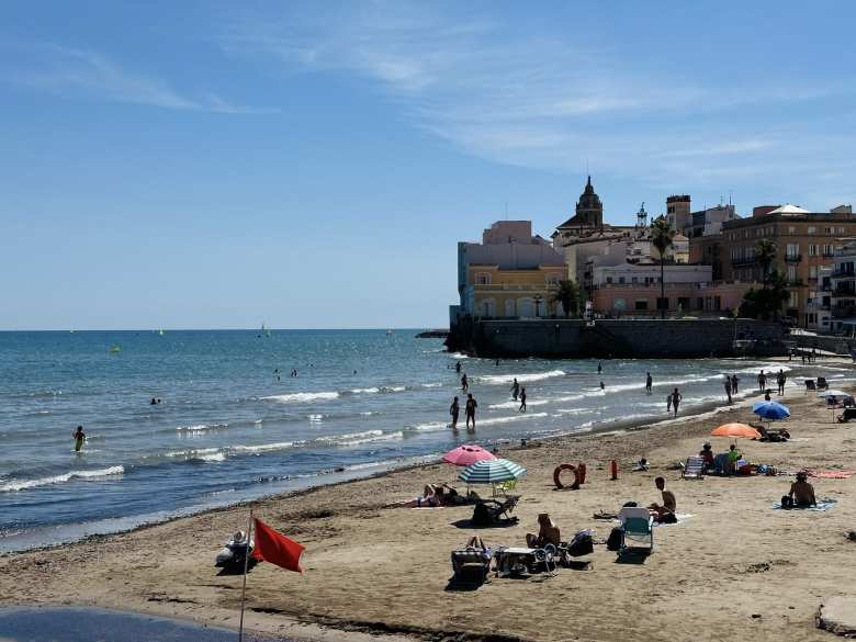 People wading in the ocean off of Sites.