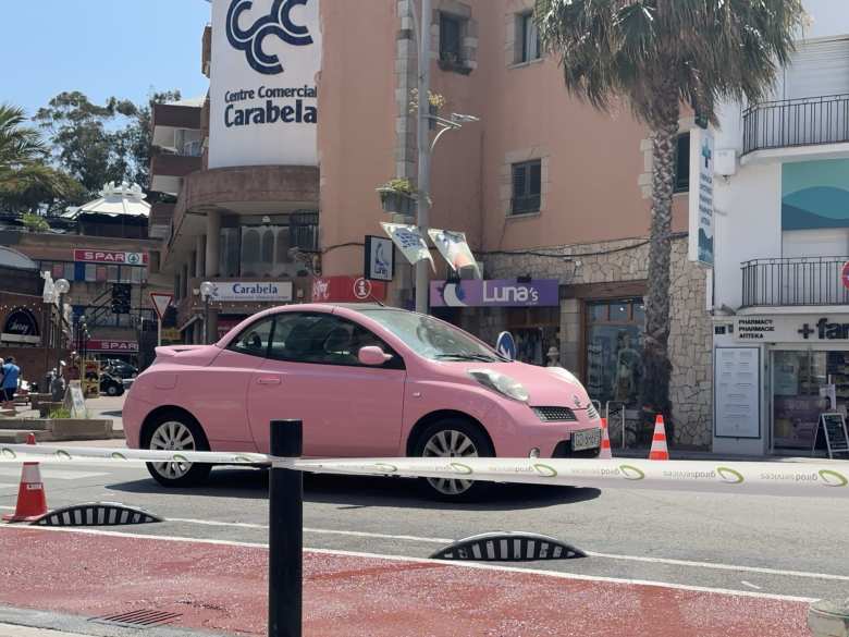 A Nissan Micra C+C Pink convertible in Lloret de Mar.