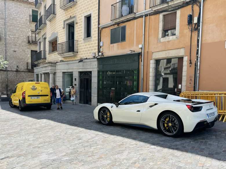 A white Ferrari 488 in Girona.