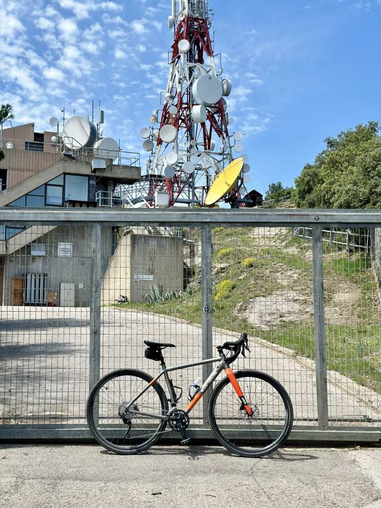 The Wilier Jareen gravel bike that I rented, with a radio tower at the top of Rocacorba in the background.