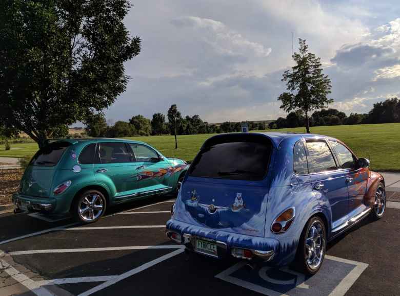 Two PT Cruisers with flames. The blue one had some sort of polar bear theme on it.