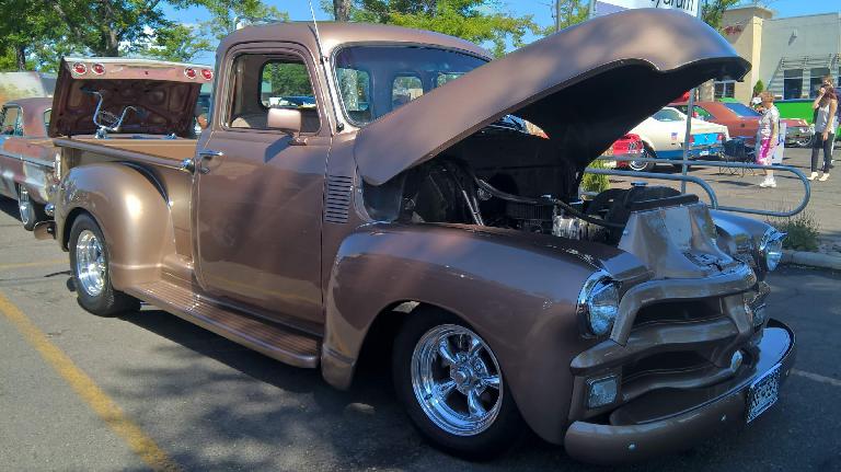A brown 1950s pickup truck.