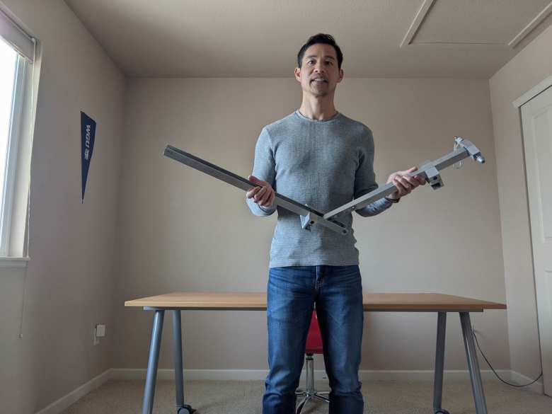Felix Wong and the folding MGB bicycle rack he had designed and manufactured at Stanford University 26 years ago, in 1996.