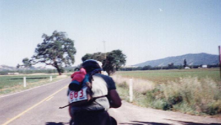 Following a cyclist within a paceline on flatlands near the end of the 1999 Davis Double Century.