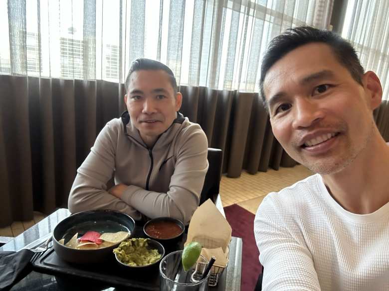 Kiet and Felix inside the Hyatt lounge at the Dallas-Fort Worth Airport's Terminal D.