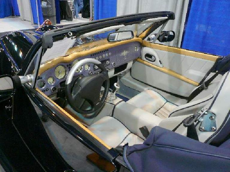 The interior of the Morgan Aero 8 is a mix of contemporary and classic styling, but the plain-front, garish steering wheel looked very out of place.