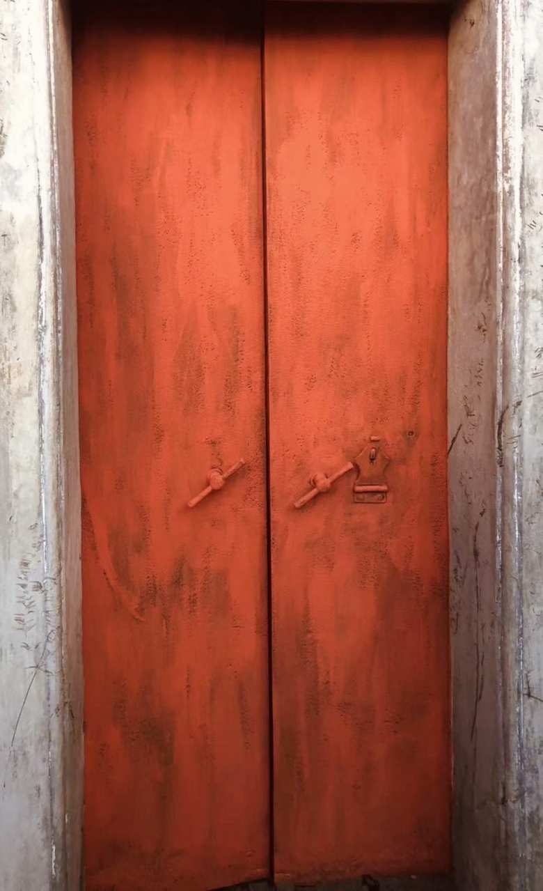 My dad's cousin in Los Angeles got someone to paint the metal door.