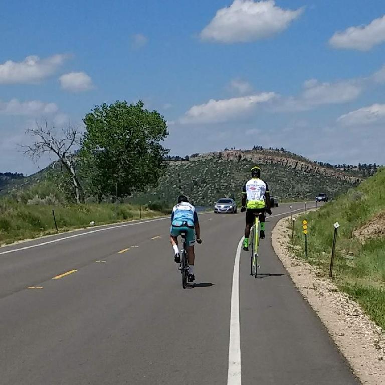 Near the Horsetooth Reservoir, someone was riding a fluorescent green penny farthing as part of the MS 150 ride.