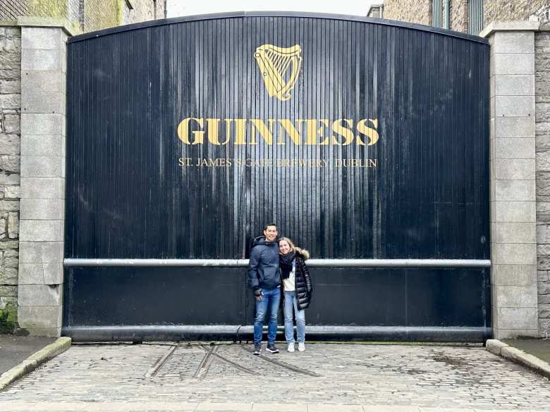 Felix and Andrea in front of a Guinness sign a few blocks away from the Guinness Storehouse.
